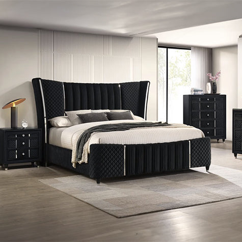Modern bedroom with black upholstered bed and matching furniture.