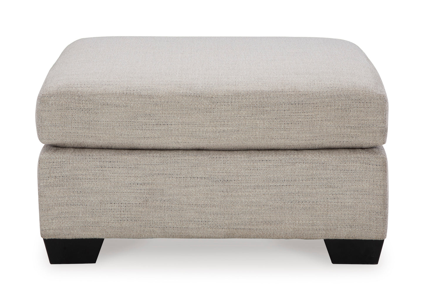 Beige ottoman with a textured surface on a white background