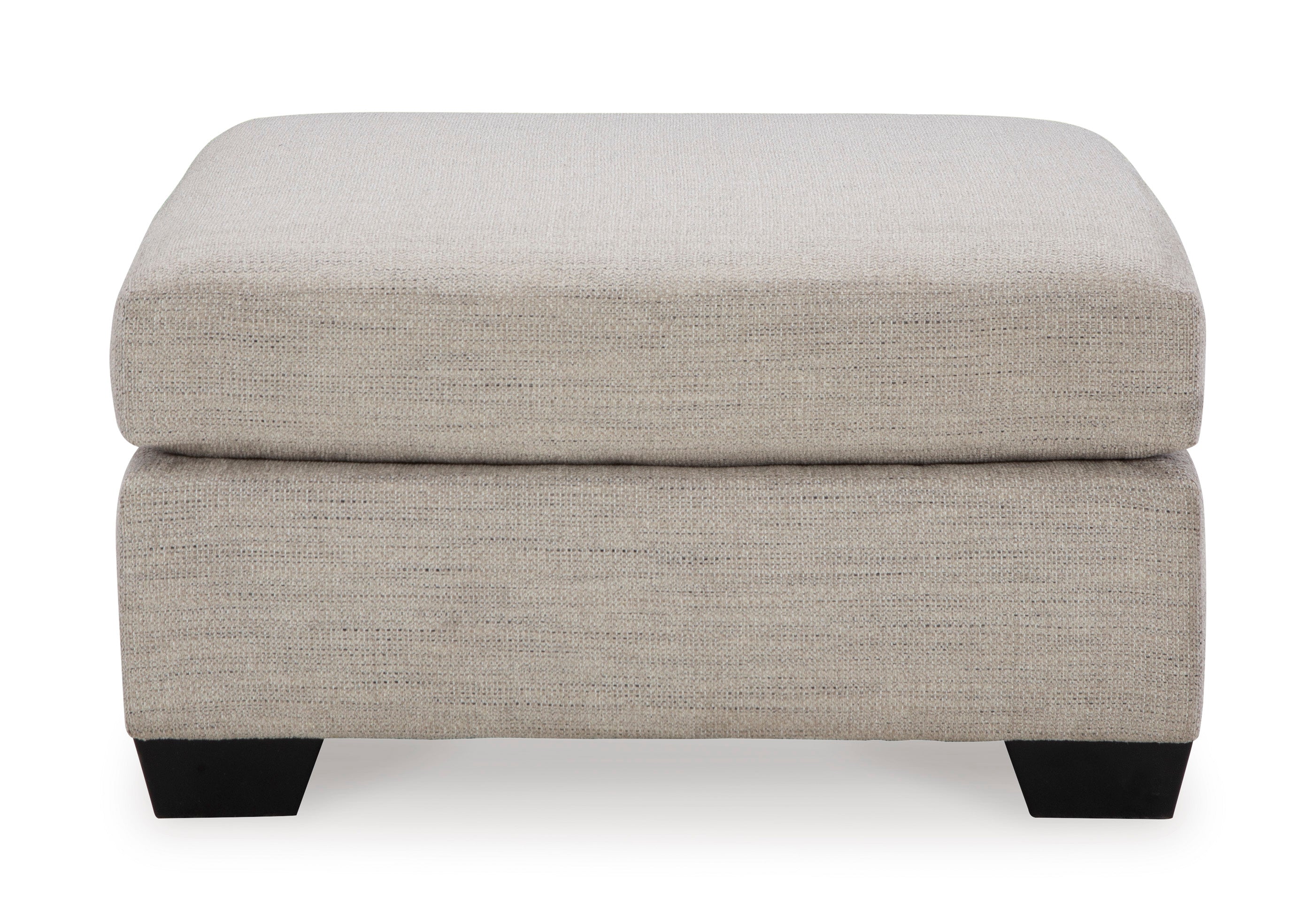Beige ottoman with a textured surface on a white background