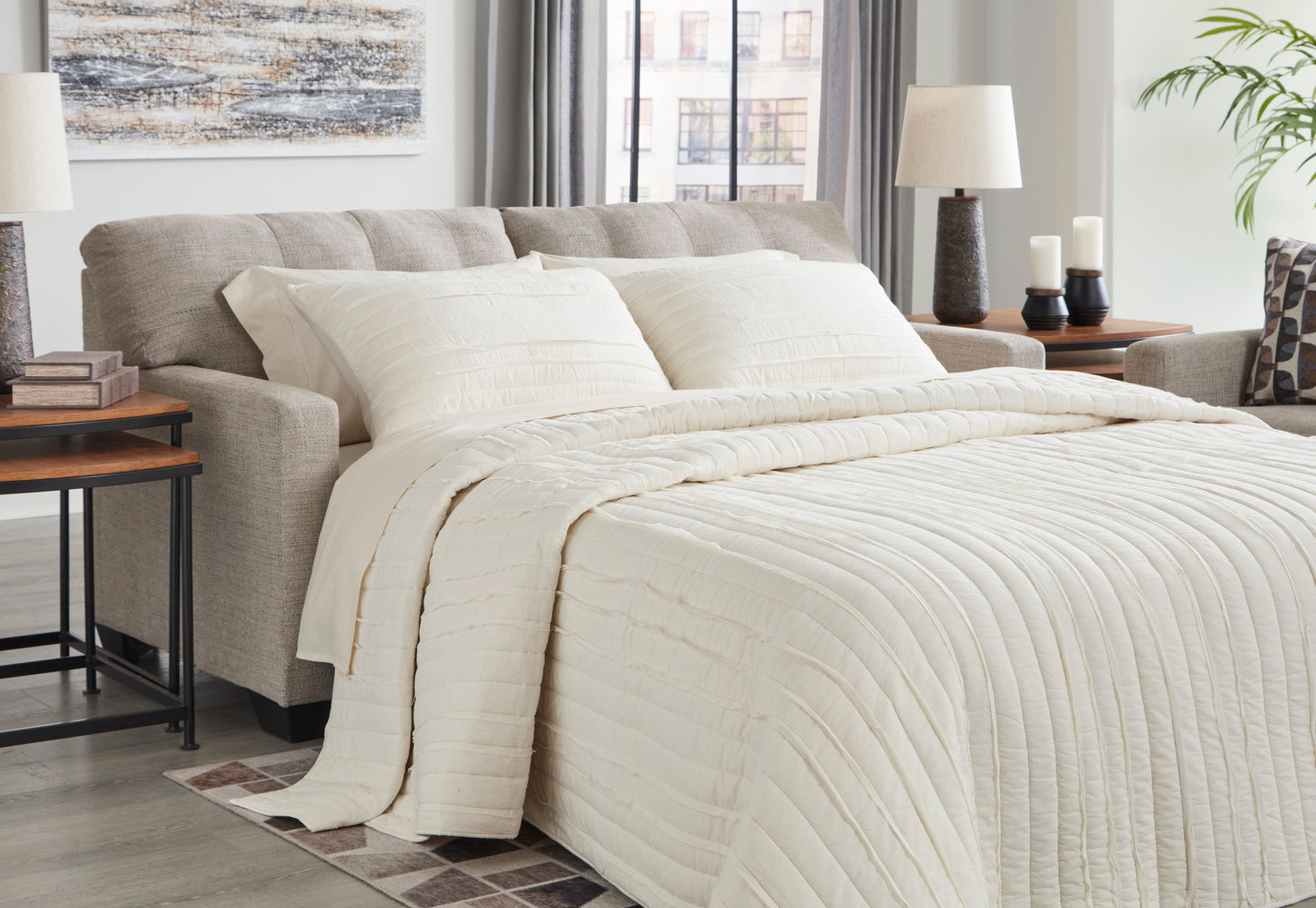 Neatly made bed with white bedding in a bedroom setting