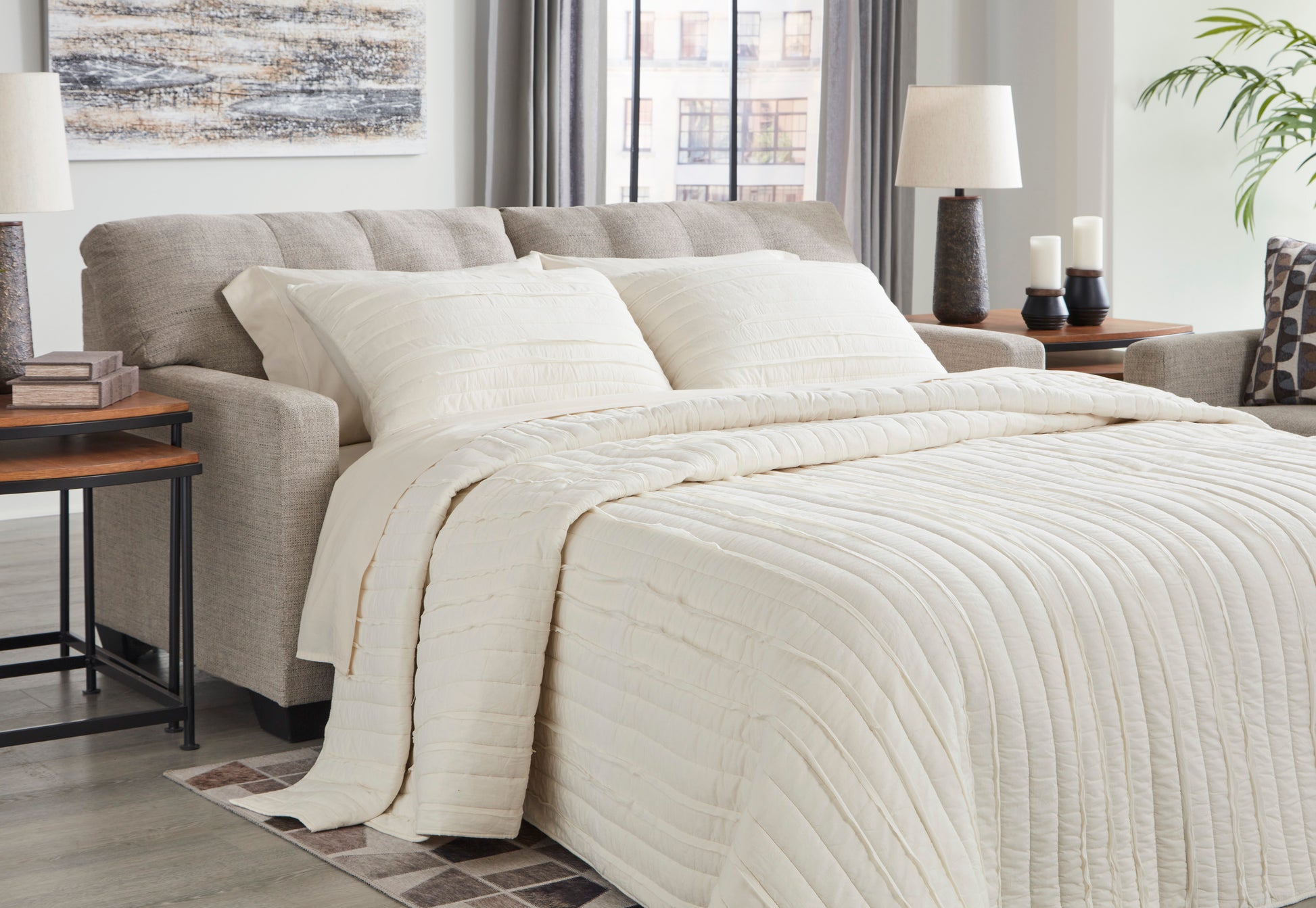Neatly made bed with white bedding in a bedroom setting