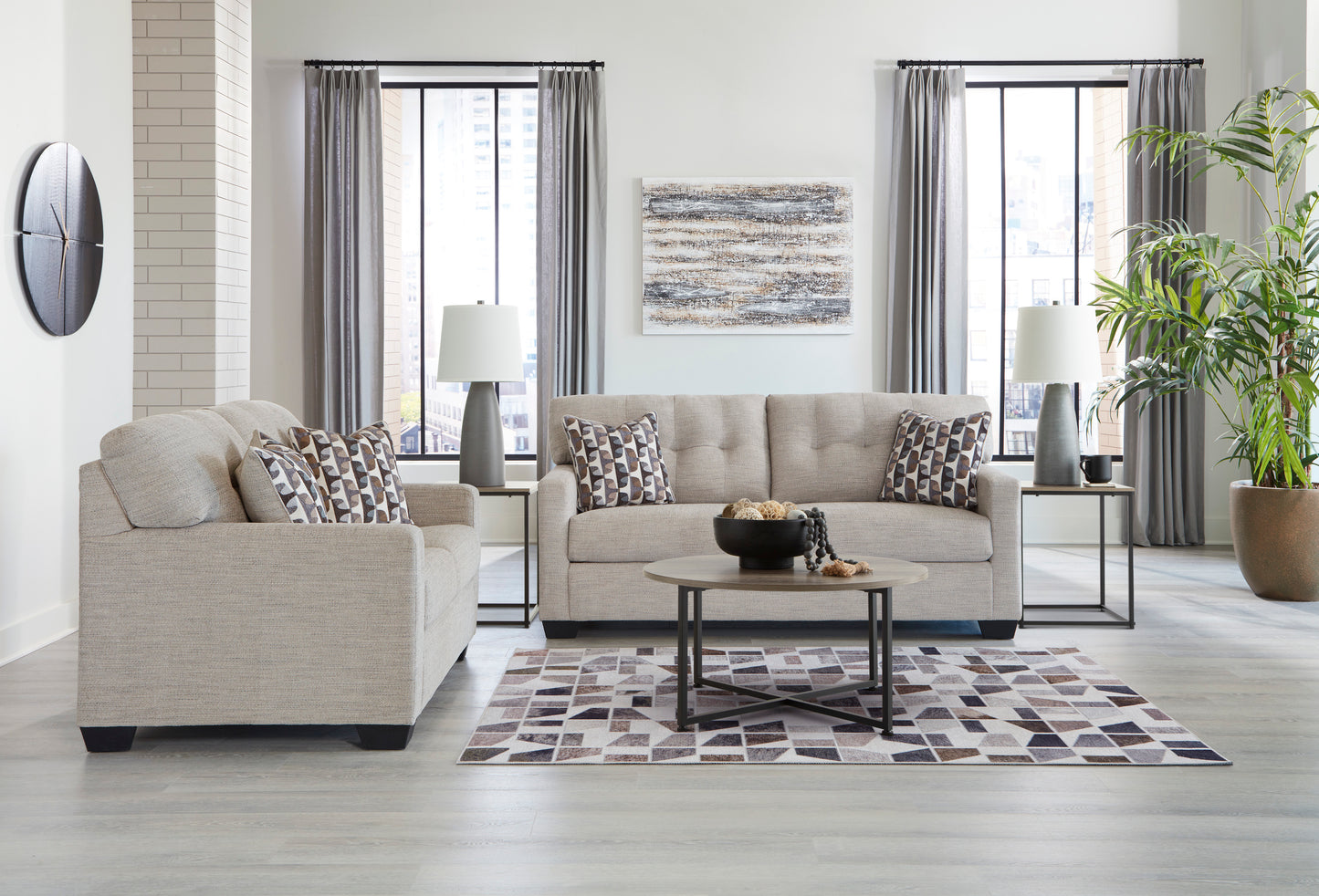 Living room with beige sofa, coffee table, and decorative elements.