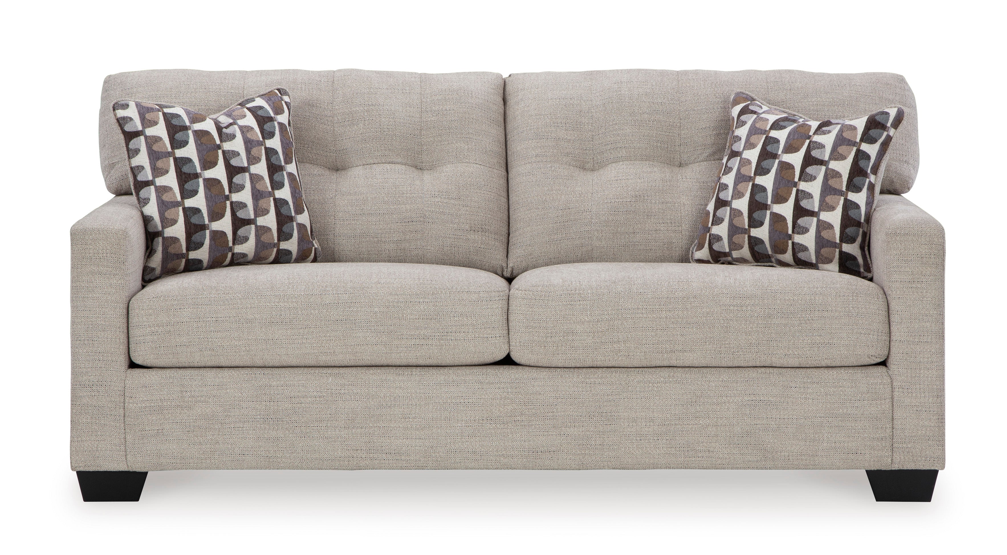 Gray sofa with patterned pillows on a white background