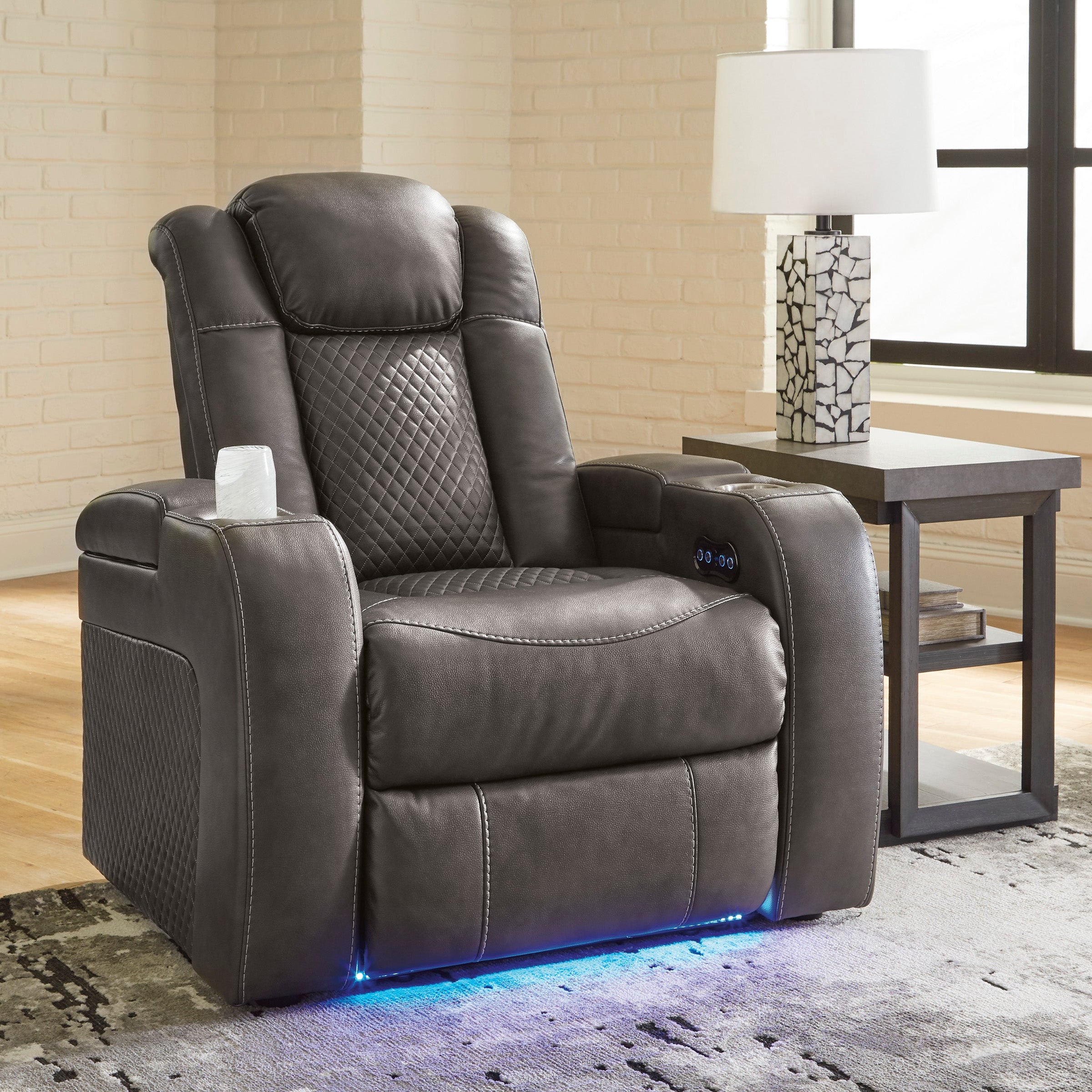 Gray recliner chair with LED lighting in a living room setting.