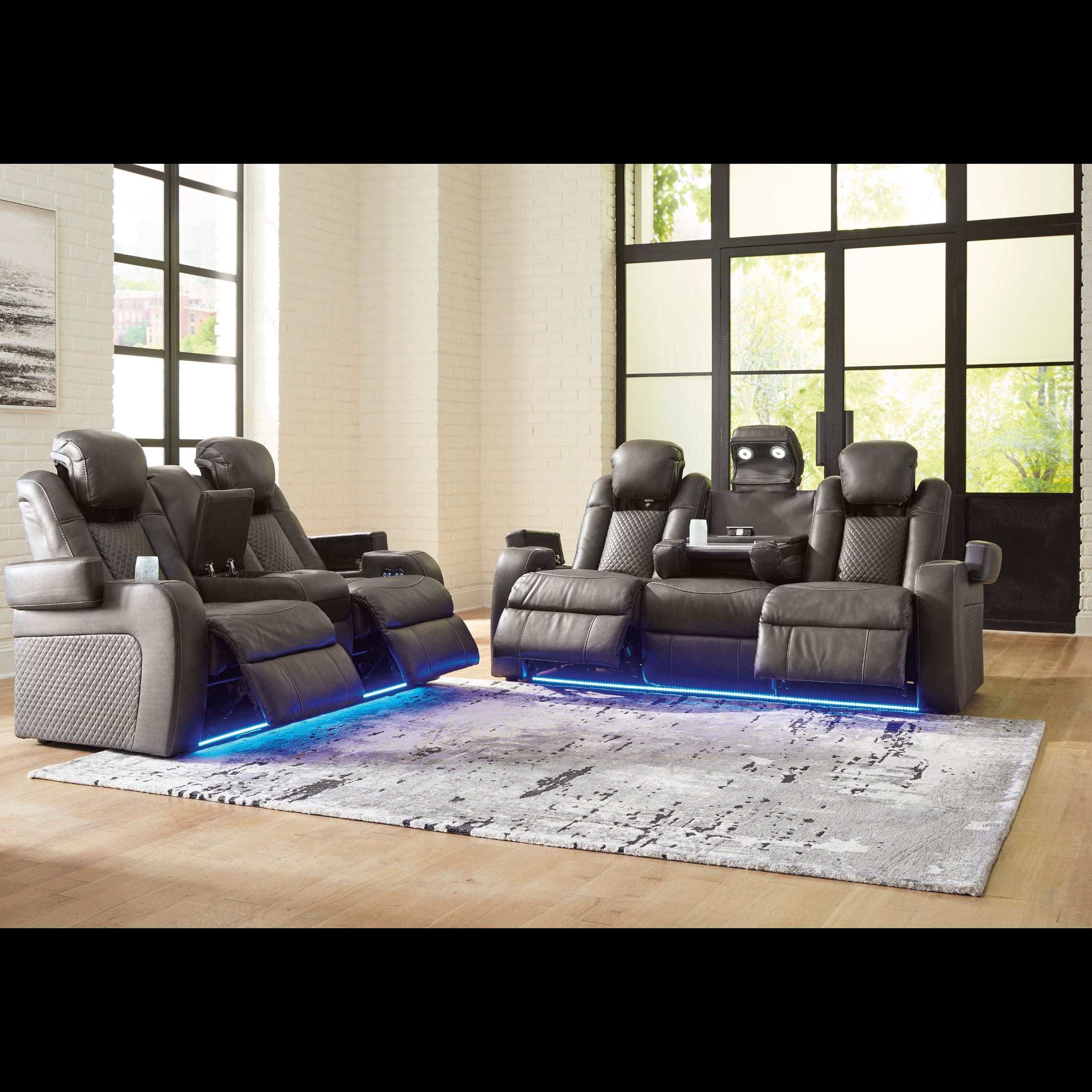 Modern home theater seating with LED lighting in a well-lit room.