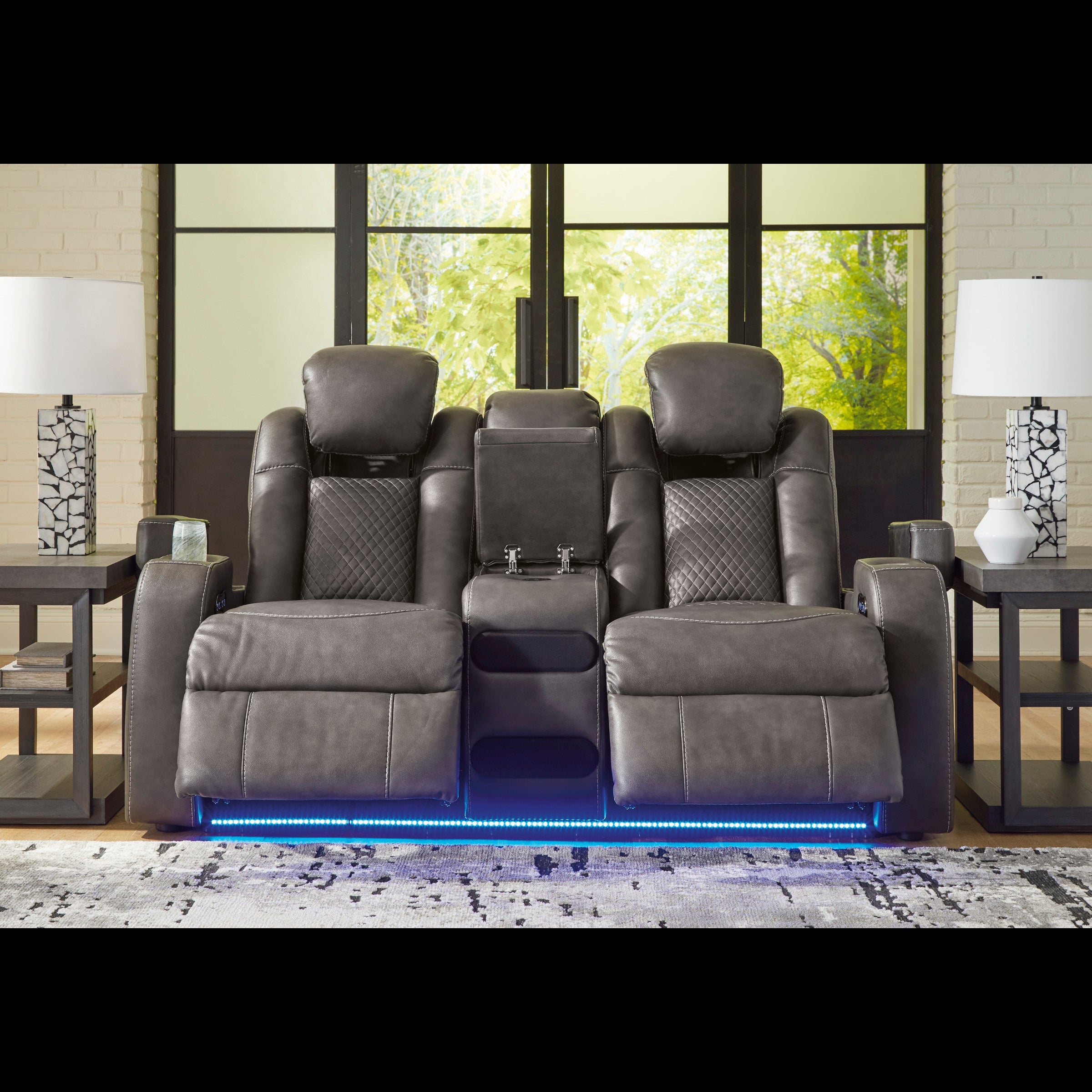 Gray recliner chairs with LED lighting in a room with large windows.
