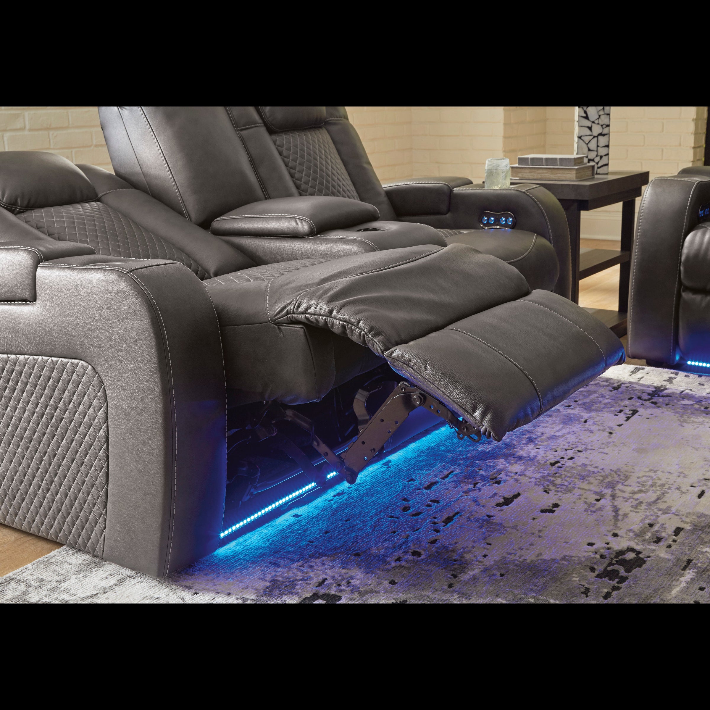 Gray recliner chairs with LED lighting on a rug