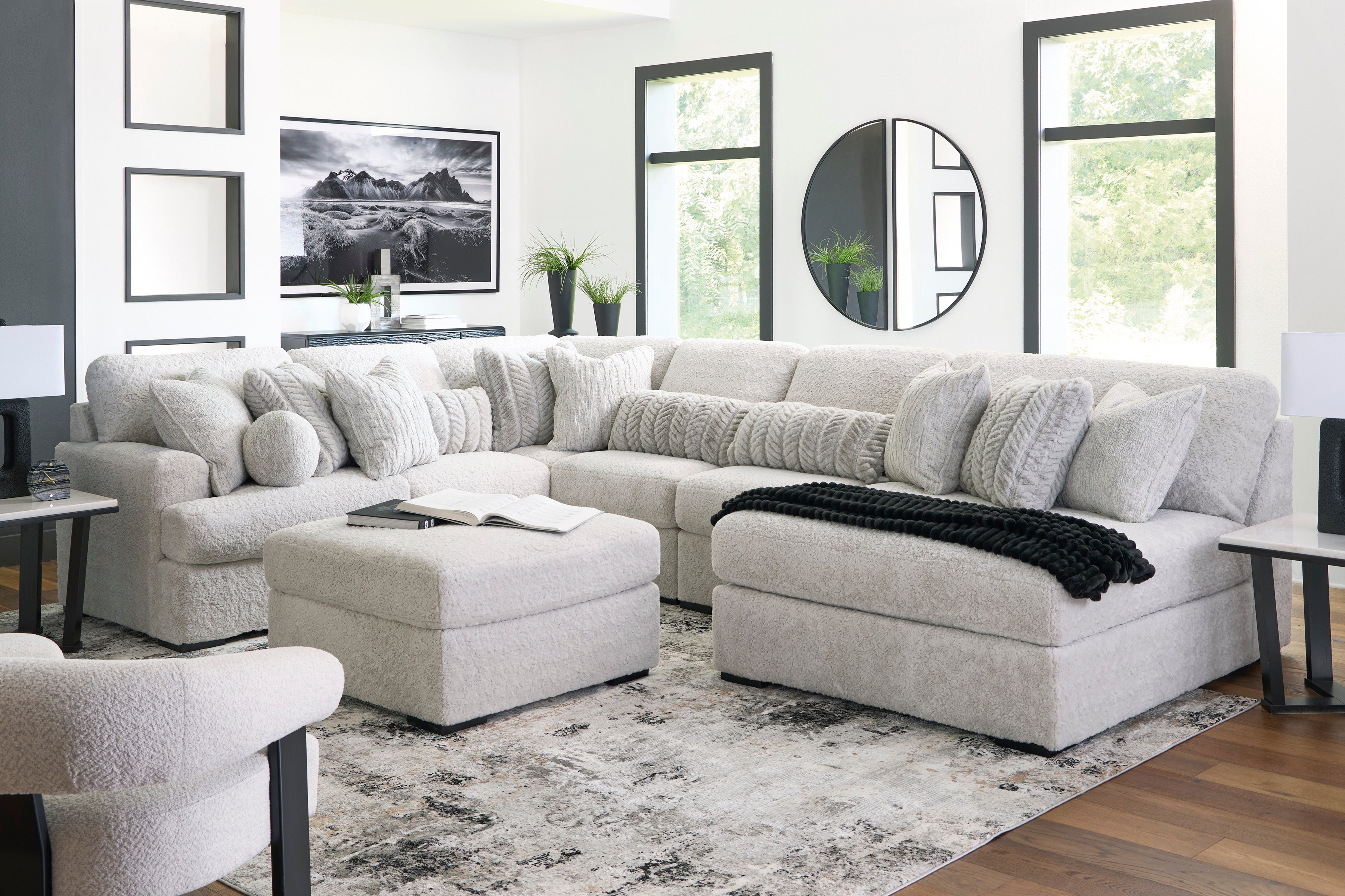 Gray sectional sofa in a living room with decor elements.