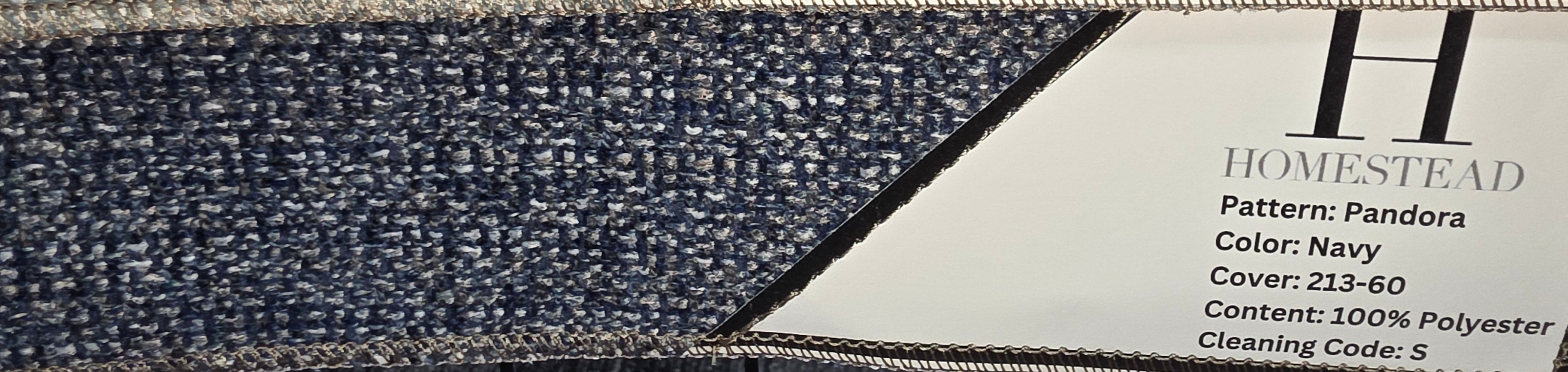 Two carpet samples from Homestead, featuring the Pandora pattern in egg and navy colors, displayed on a black wire rack with product labels visible.