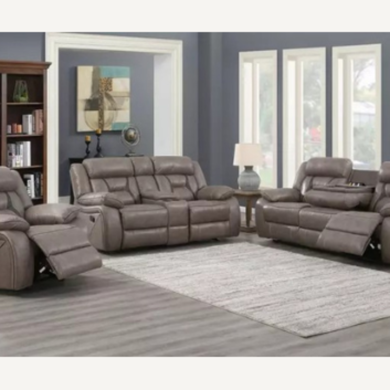 A set of gray manual reclining glider recliners from the Tyron collection, showing a three-seater sofa and two recliner chairs placed in a living room setting.