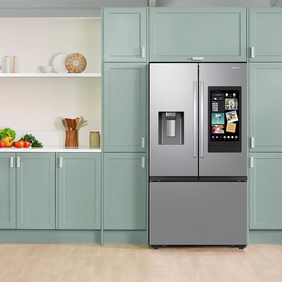 Smart refrigerator in a modern kitchen with light green cabinets and a neutral color palette.